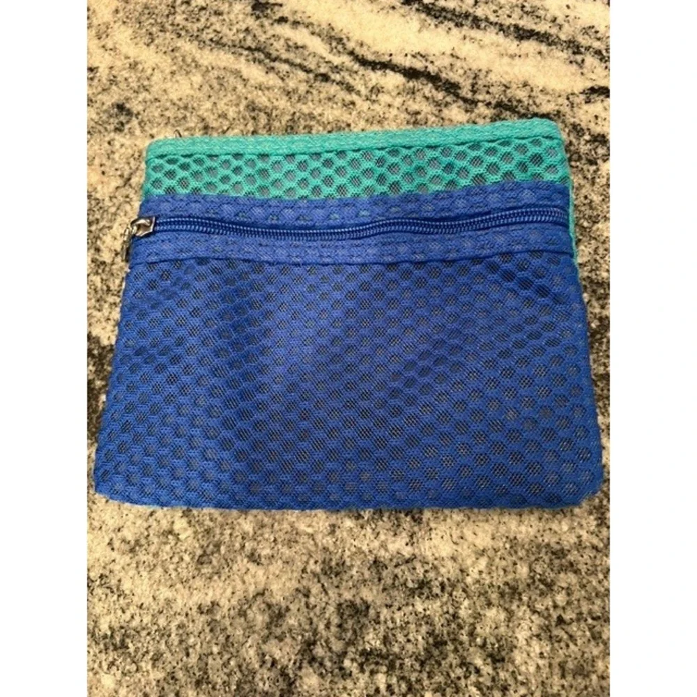 A New Day Green Zip Around Continental Wallet Wristlet‎ and a blue/teal pouch